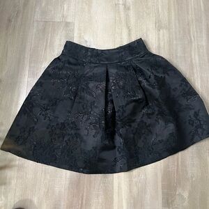 Black skirt with subtle flowers in front